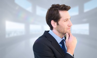 Poster - Composite image of thinking businessman touching his chin