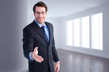 Poster - Composite image of hand being offered by smiling businessman