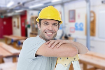 Poster - Composite image of happy technician leaning on step ladder