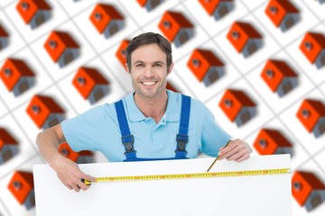 Poster - Composite image of happy carpenter measuring blank bill board