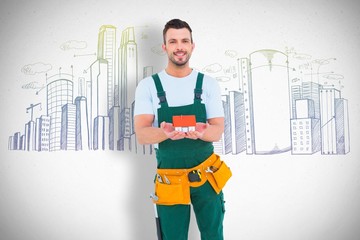 Poster - Composite image of happy construction worker holding house model