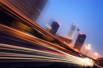 Wall Mural - the light trails on the modern building background in shanghai china