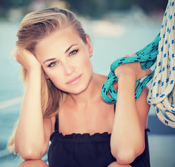 Wall Mural - Serious girl on sail boat