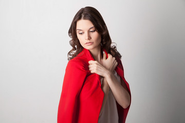 Young beautiful woman holding red jacket