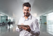 © stokkete - Smiling confident man with tablet