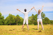© danmorgan12 - Young Caucasian Couple Standing Together on Grass Meadow with ha