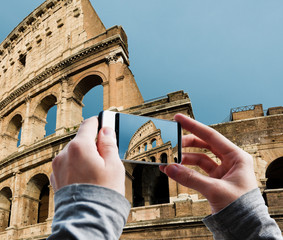 Wall Mural - Tourist taking a picture of Great Colosseum, Rome, Italy