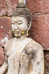 old buddha statue in antique stone castle