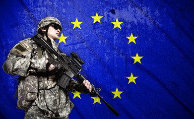 Wall Mural - soldier on European Union flag background