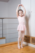 © cwzahner - Little girl practicing ballet in a dance studio
