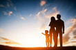 © Photocreo Bednarek - Happy family together, parents with their child at sunset.