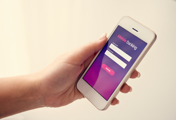 Wall Mural - female hand using mobile banking