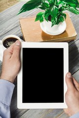 Canvas Print - Ipad. Digital tablet computer with isolated screen in male hands