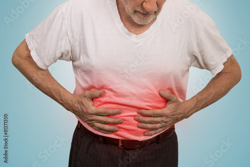 Fényképezés Stomach ache, man placing hands on the abdomen