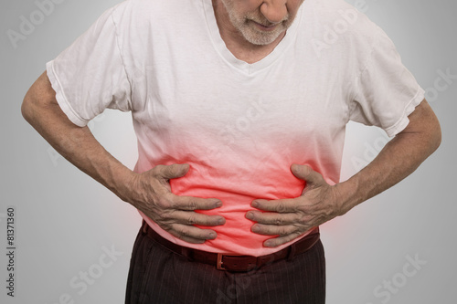 Fotografija Stomach ache, man placing hands on the abdomen
