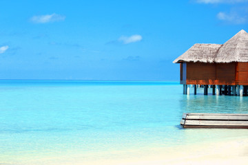 Wall Mural - View of beautiful blue ocean water and bungalows in Baros