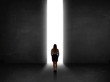 © ra2 studio - Business person looking at wall with light tunnel opening