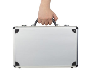 Hand and arm holding silver luggage or brief case isolated on wh