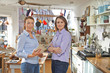 © highwaystarz - Portrait Of Two Women Running Cook Shop Together