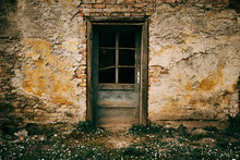 Old Door On Abandoned Building Facade