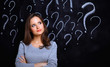 © shefkate - Young girl with question mark on a gray background