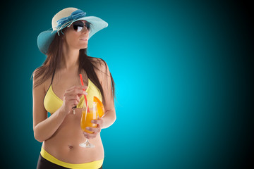 Wall Mural - Young sexy brunette in yellow swimsuit