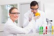 © WavebreakMediaMicro - Scientists injecting orange