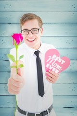 Poster - Geeky hipster holding a red rose and heart card