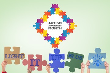 Poster - Composite image of hands holding up jigsaw pieces