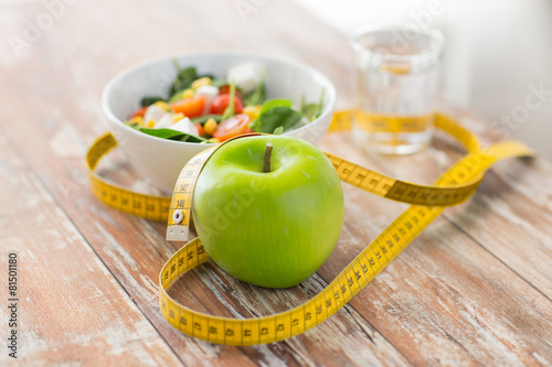 Fotografie, Obraz close up of green apple and measuring tape