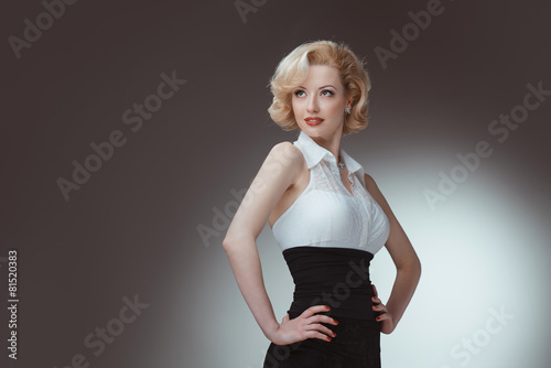 Fotografia, Obraz Pin-up girl young and beautiful woman portrait on gray