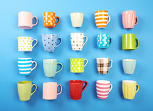 Group Of Colorful Cups On Color Table, Closeup