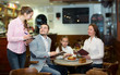 © JackF - waitress and happy family