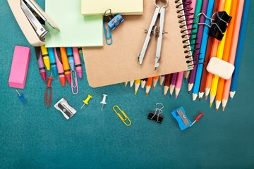 Wall Mural - School. School supplies on blackboard background ready for your