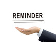 © JoyImage - reminder word holding by businessman's hand