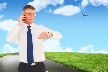 Poster - businessman on the phone looking at his wrist watch