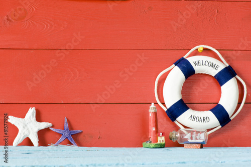 Fotografie, Obraz Lifebuoy with Welcome on Board phrase on wooden background