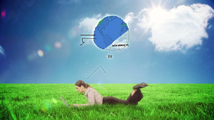 Poster - Businesswoman using laptop in a field