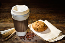 Paper Cup Of Coffee And Cookie On Wooden Background