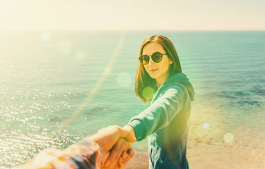 Poster - Couple in love resting on coastline near the sea