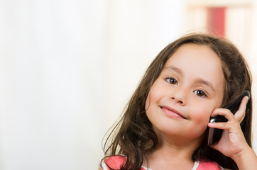 cute little girl using cell phone