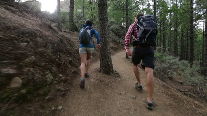 couple running having fun while hiking