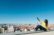 © VICTOR TORRES - Young Woman Taking a Selfie from a City Viewpoint