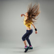 © Stasique - Young energetic zumba fitness woman dancer moving in class