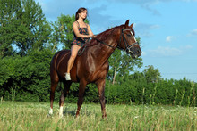 Romantic Female Model Riding Horseback