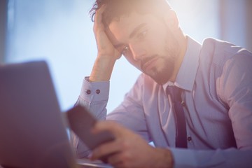 Poster - Businessman using laptop at desk