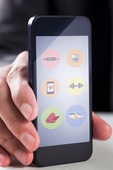 Poster - Composite image of businessman using smartphone