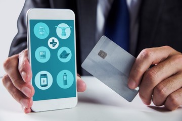 Poster - Composite image of businessman using smartphone