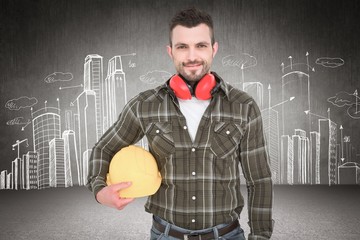 Poster - Composite image of handyman with earmuffs holding helmet