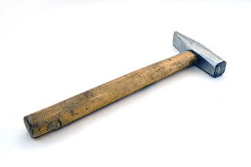 old hammer on a white background